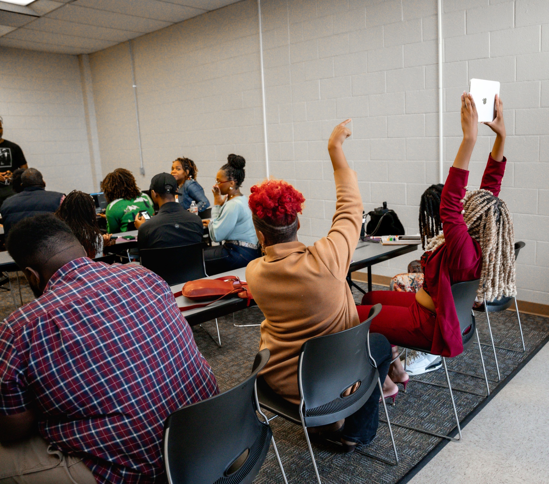 Founders raising hands during a Business Empowerment Workshop