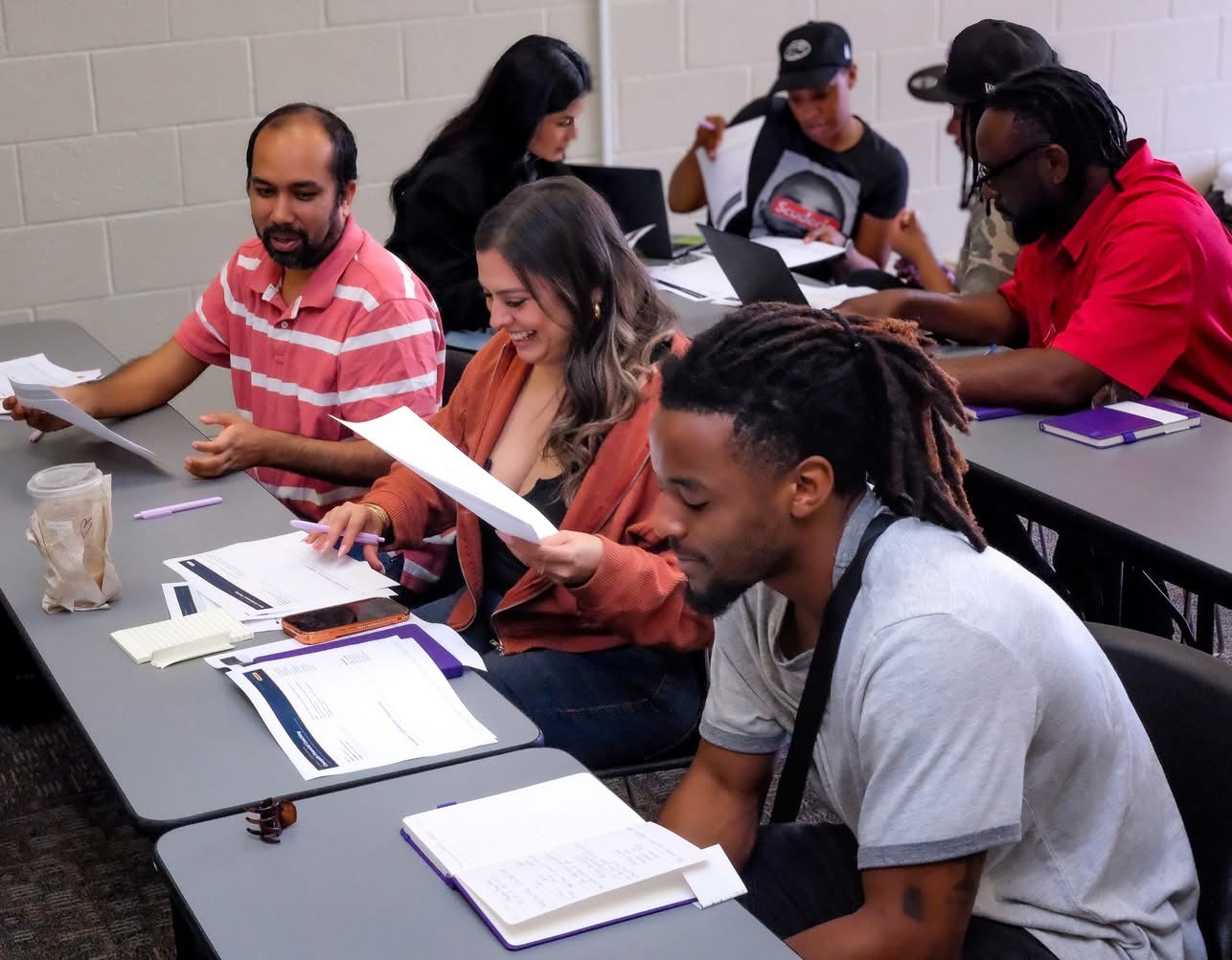 Founders reviewing worksheets side by side